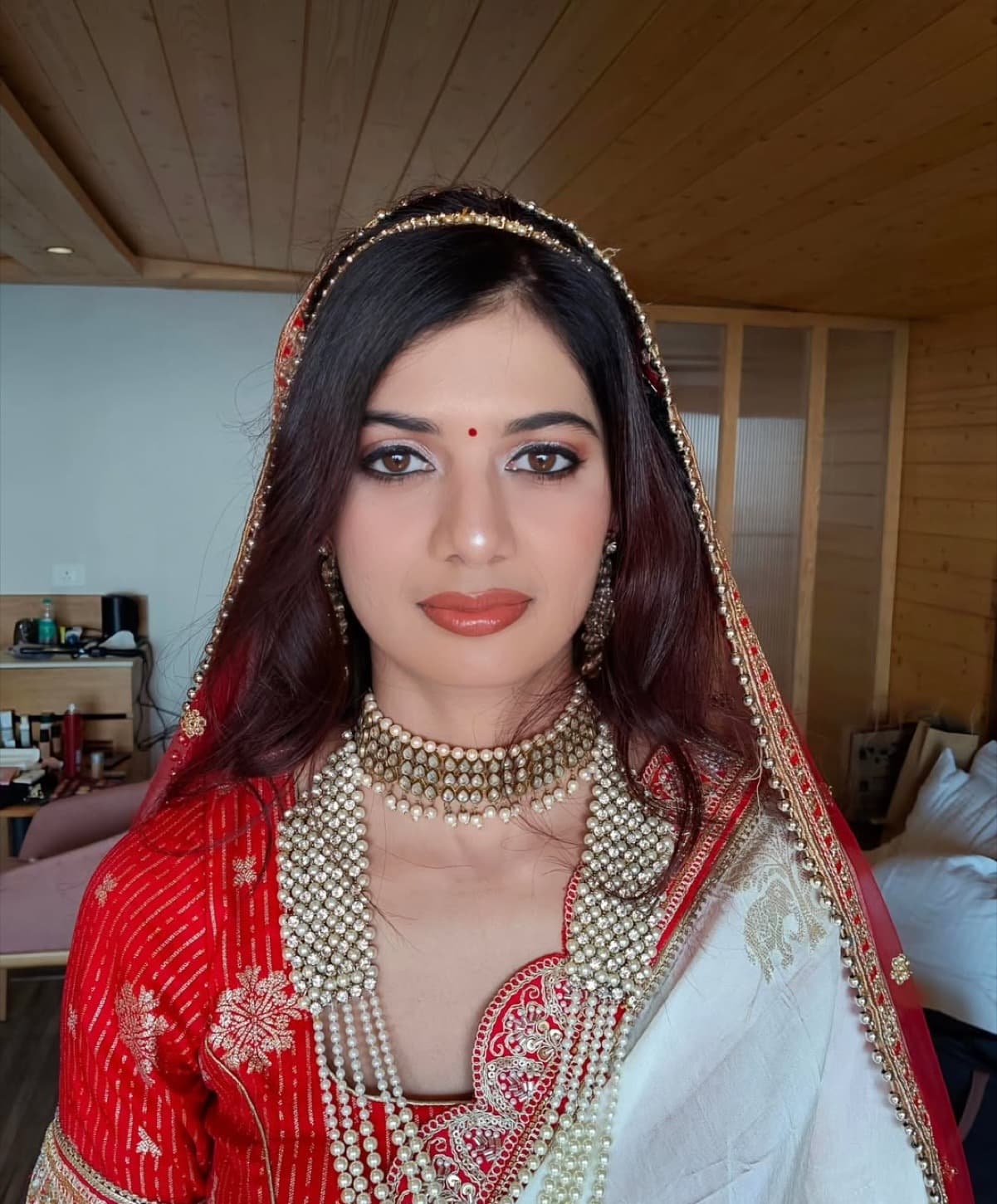 Close portrait of Nidhi showing her finished bridal makeup by Shivani